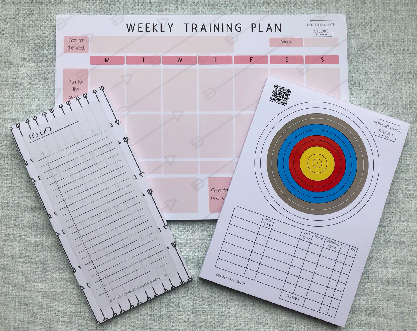 Archery weekly training planner, an archery target face plotting and scoring pad, and an archery themed to do notepad