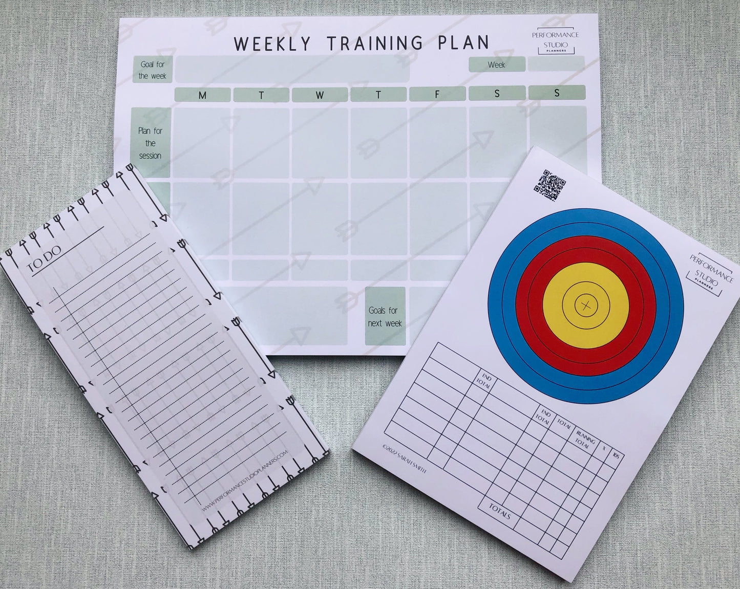 Archery weekly training planner, an archery target face plotting and scoring pad, and an archery themed to do notepad