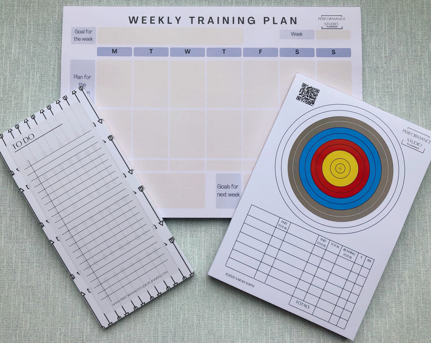 Archery weekly training planner, an archery target face plotting and scoring pad, and an archery themed to do notepad