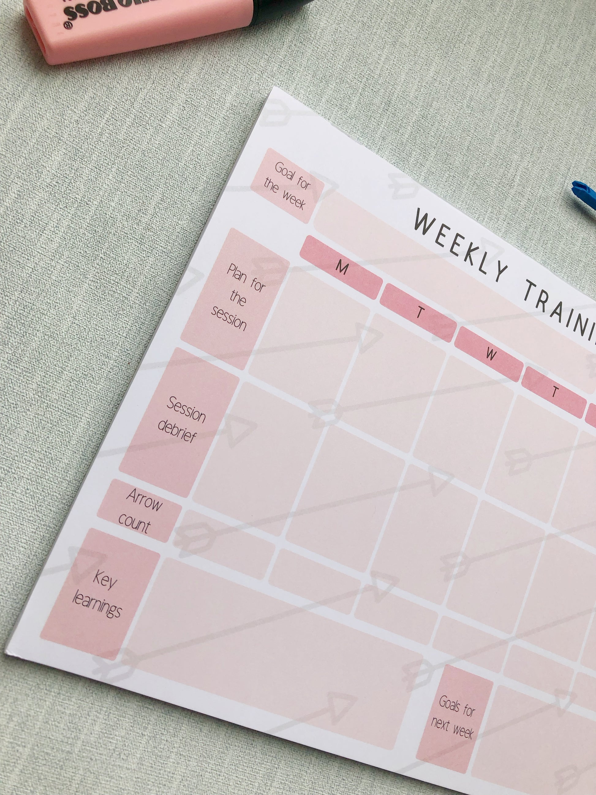 pink themed archery weekly planner. With different sections titled, goal for the week, plan for the session, session debrief, arrow count, key learnings, and goal for next week.