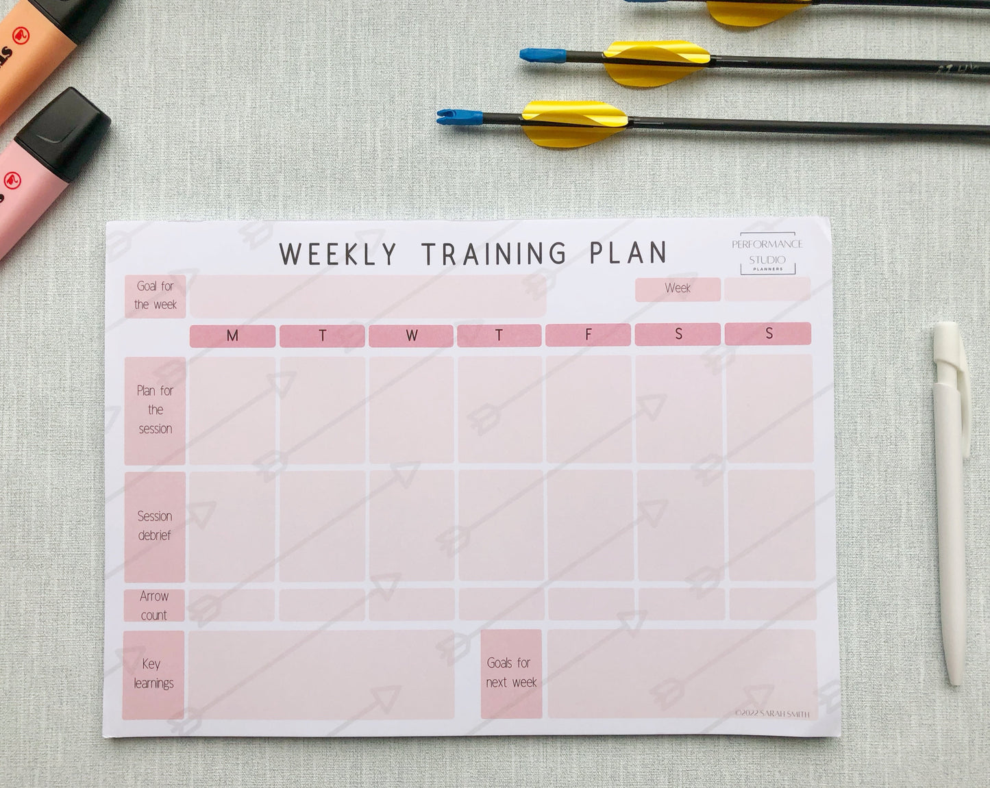 pink themed archery weekly planner. With different sections titled, goal for the week, plan for the session, session debrief, arrow count, key learnings, and goal for next week.